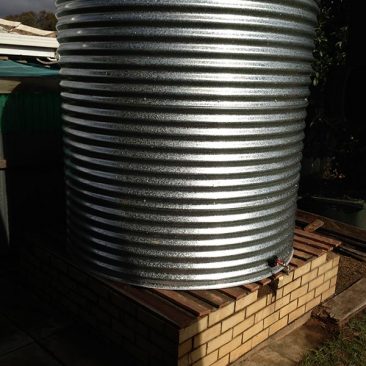 galvanised steel rainwater tank on existing base