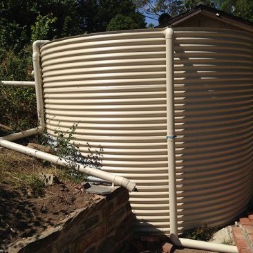 cream aquaplate tank in existing garden area