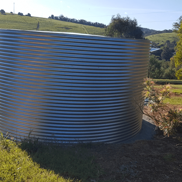 Galvanised Steel rainwater tank on hill at clarendon property