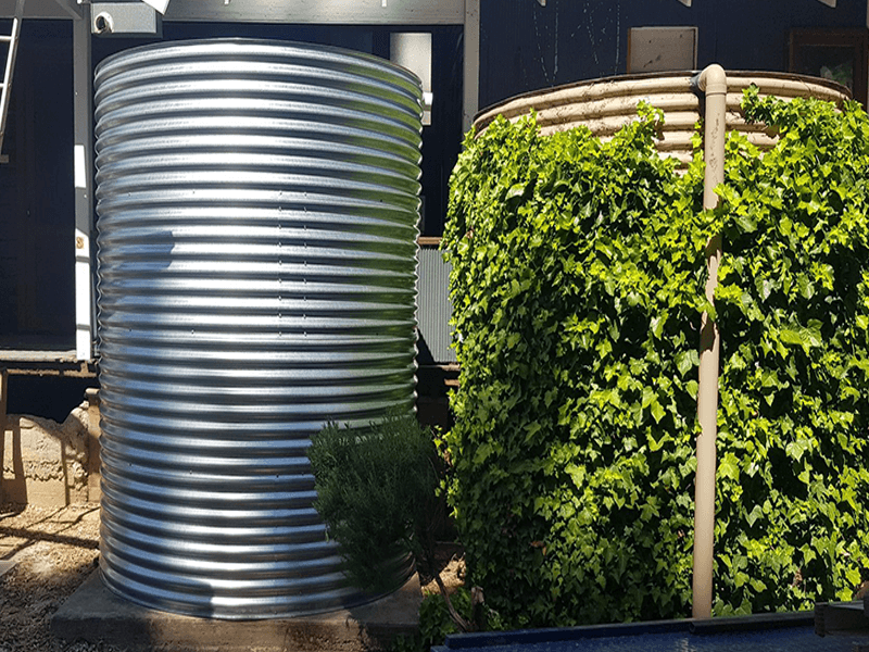 galvanised rainwater tank next to existing rainwater tank for home in Clare SA